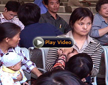 mother and child inside the Shanghai railway station